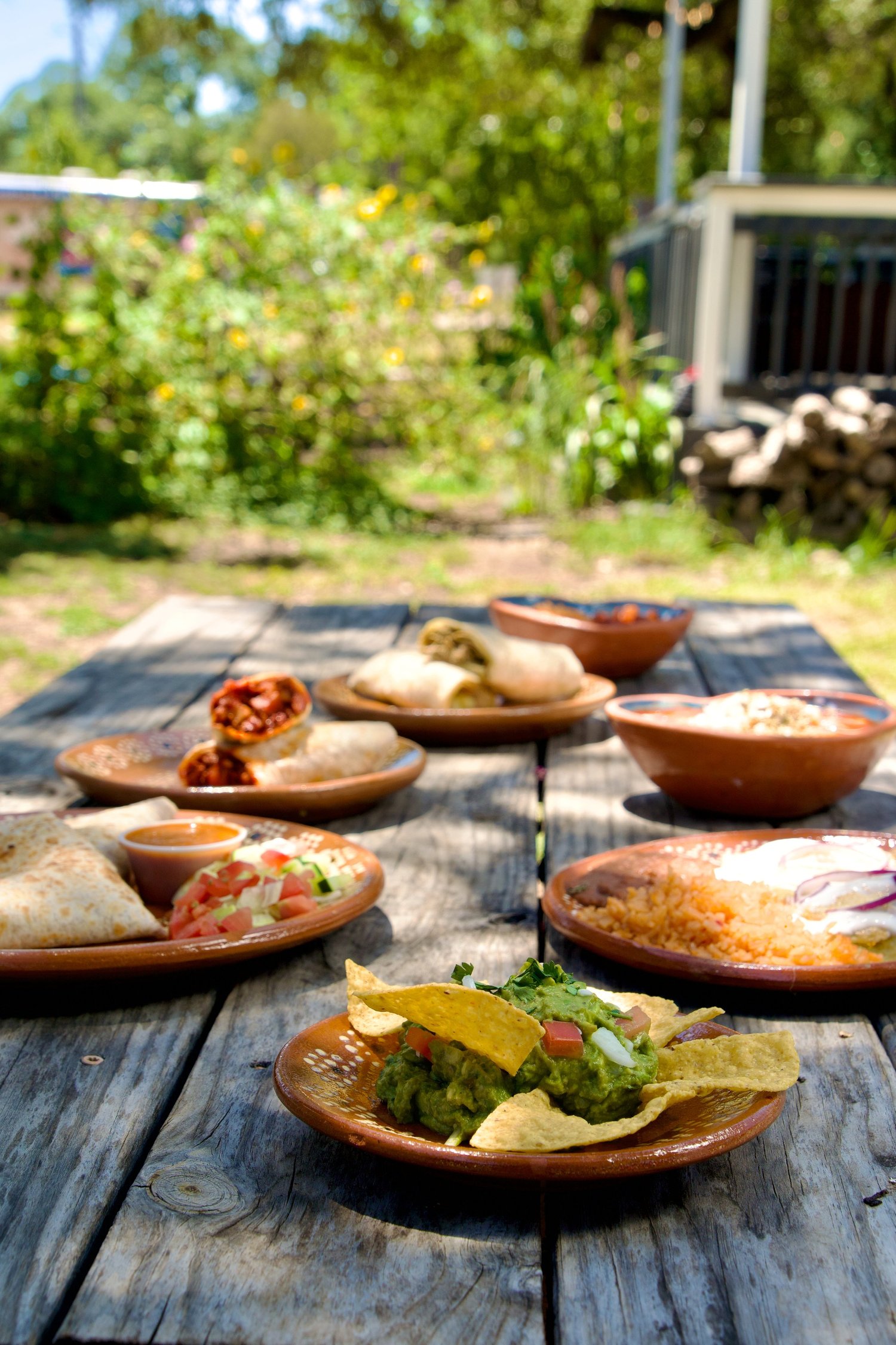 A table filled with Northern Mexican dishes from Itaa’s Street Kitchen